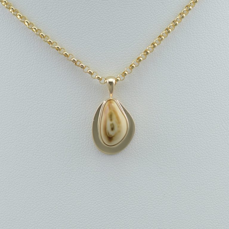 Elk ivory pendant with 14kt yellow gold flange