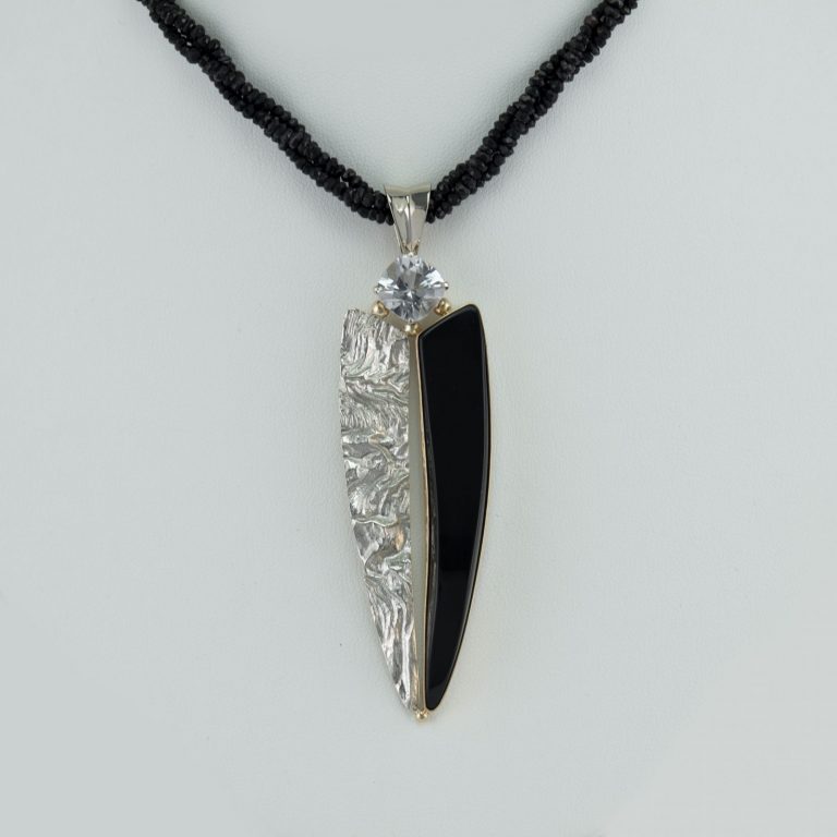 Wyoming jade pendant with colorless tourmaline and reticulated silver