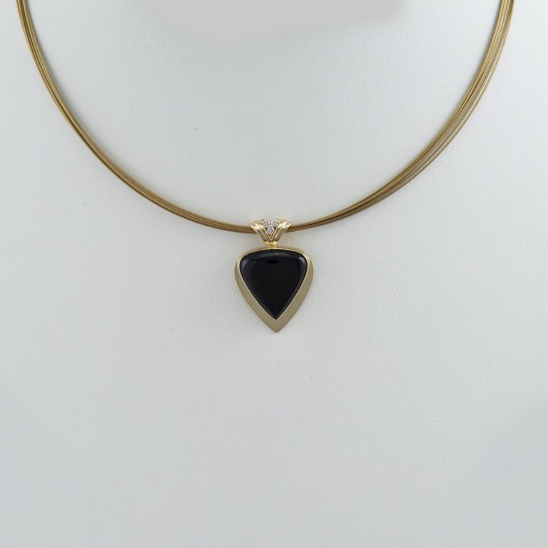Black jade pendant with diamond accents in 14kt gold