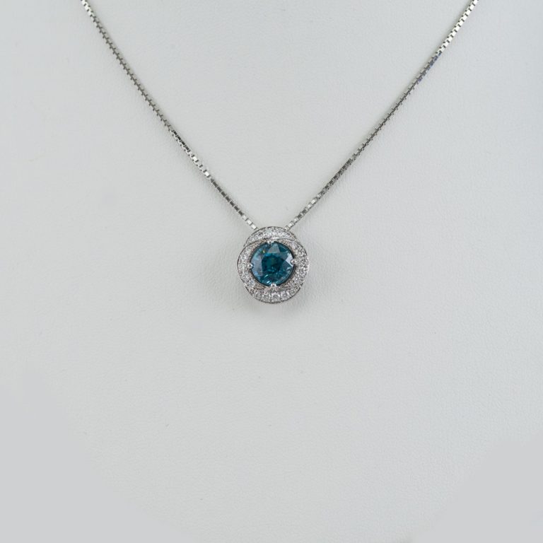 Blue zircon pendant with diamond accents