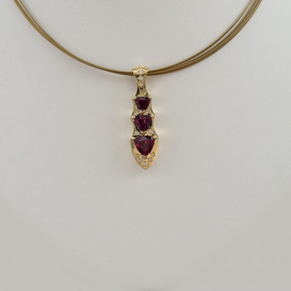Garnet pendant with diamond accents