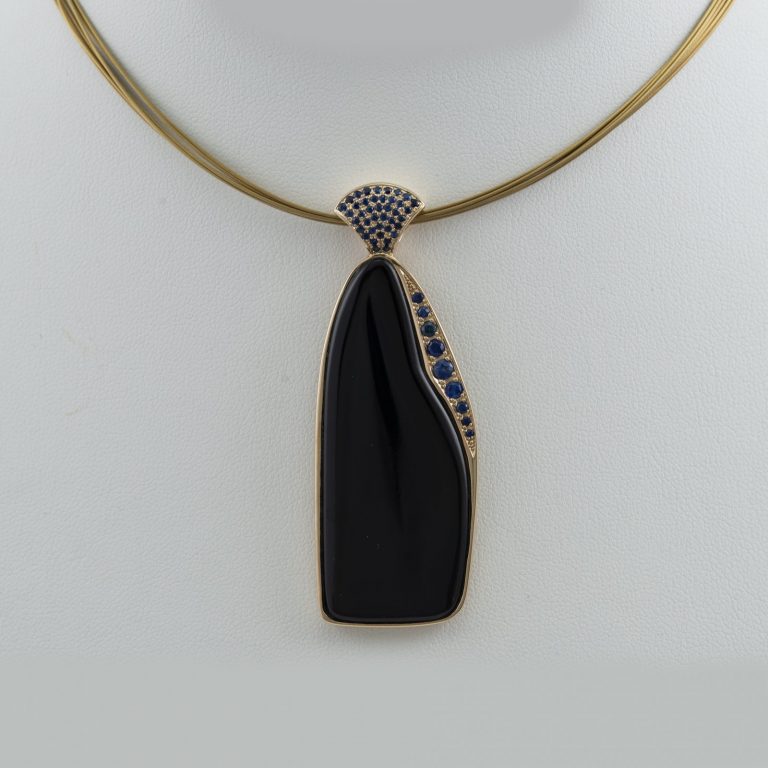 Jade pendant with blue sapphires and 14kt yellow gold
