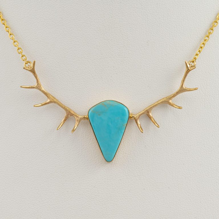 This is our Kingman Antler Necklace. The turquoise has been set in 14kt yellow gold. The turquoise is from the kingman mine.