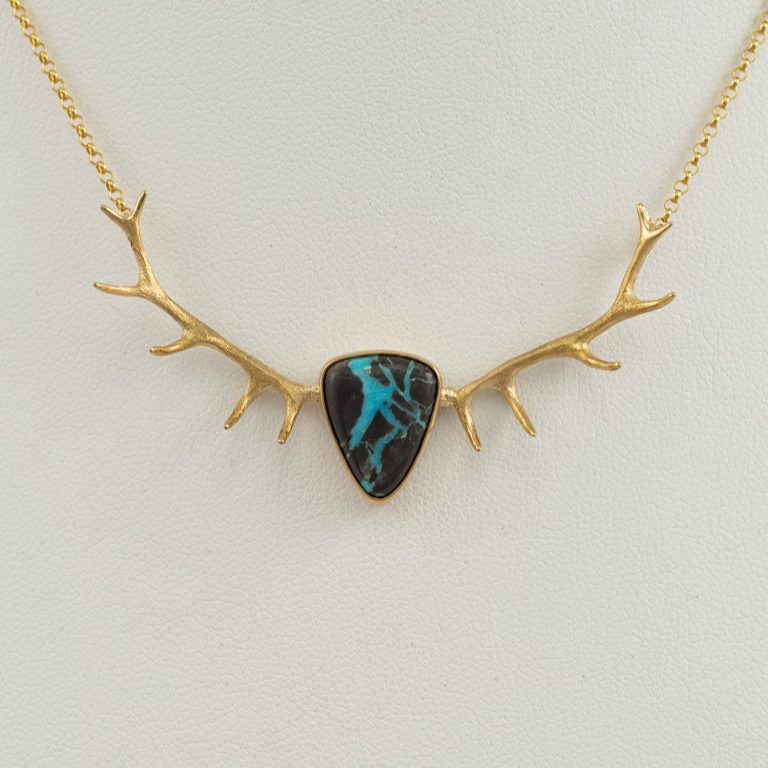 Turquoise antler pendant in 14kt yellow gold. Chain is included in the price. We have several versions of the Turquoise antler pendant.