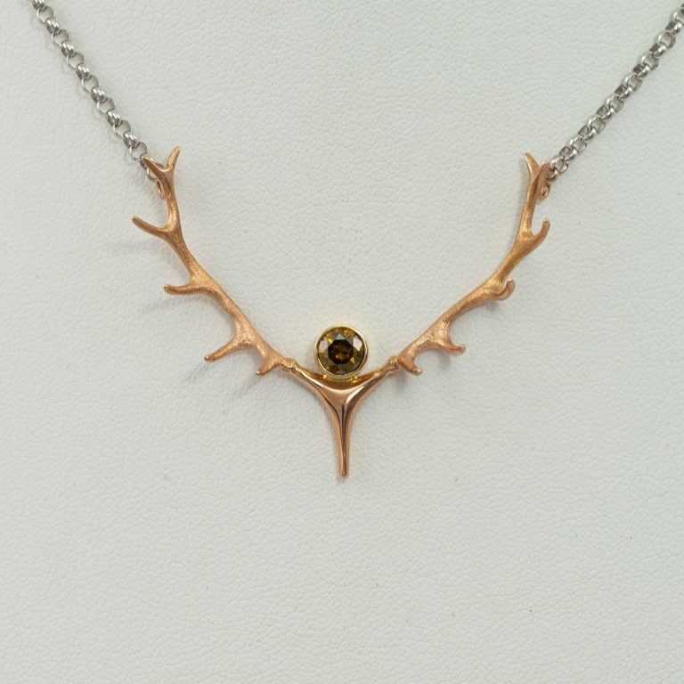 Champagne antler pendant in 14kt rose gold with matching chain. The center stone is a .72ct Brilliant Cut Champgane Diamond.