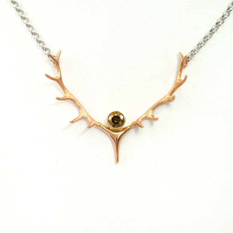 Champagne antler pendant in 14kt rose gold with matching chain. The center stone is a .72ct Brilliant Cut Champgane Diamond.