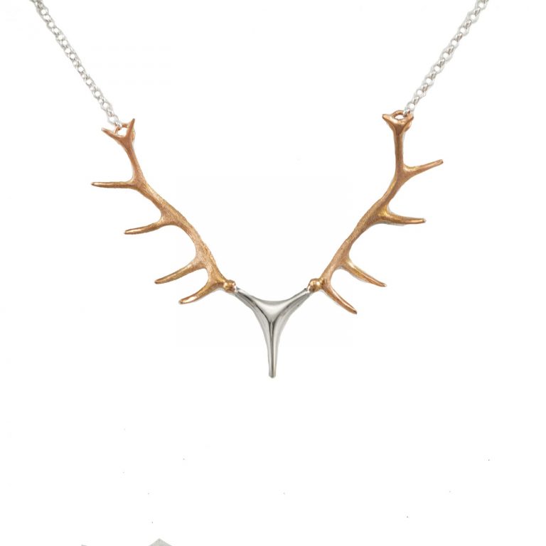 This is our large antler necklace in two-tone 14kt rose and white gold. This pendant also comes in a variety of other colors.