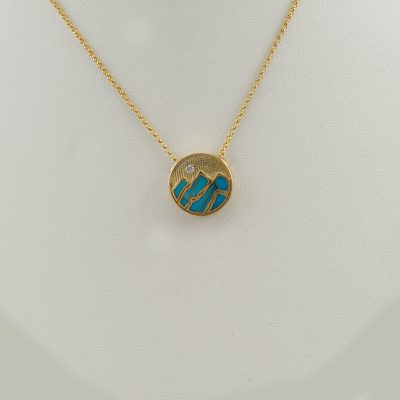 Small Turquoise Teton Pendant in 14kt yellow gold. It is accented with a briliant-cut, white Diamond. The chain is not included in the price.