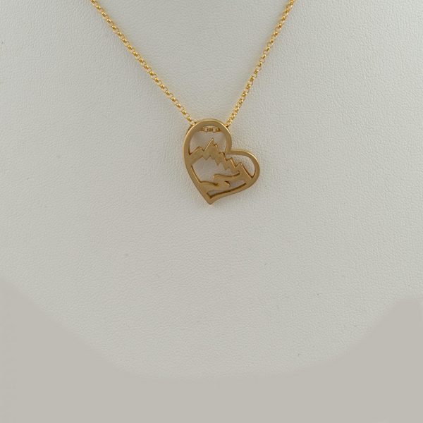 Large Heart Teton pendant in 14kt yellow gold. This pendant can be ordered with a blue or white Diamond (at an additional cost). Chain not included.