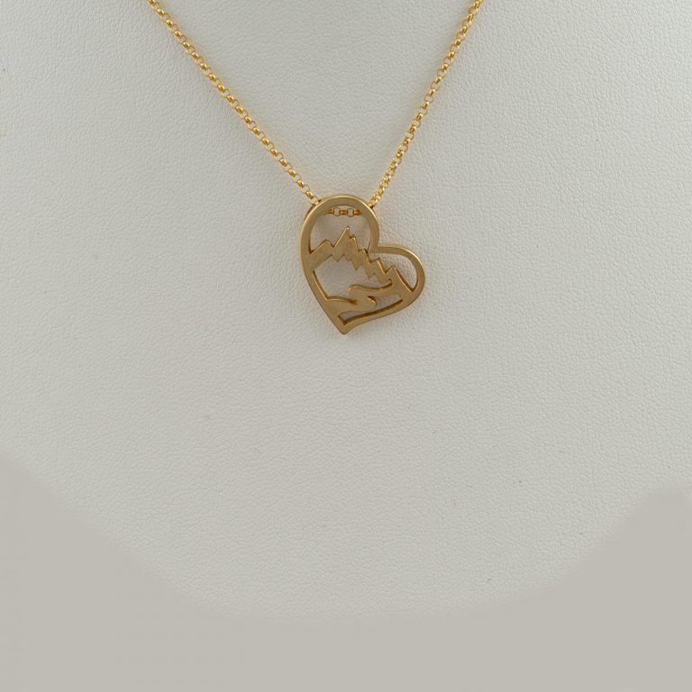 Large Heart Teton pendant in 14kt yellow gold. This pendant can be ordered with a blue or white Diamond (at an additional cost). Chain not included.