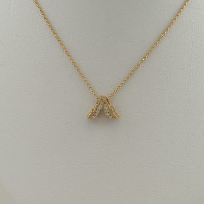This is the Medium Grand Teton slide. It has been cast in 14kt yellow gold and has Diamond accents. The chain is not included in the price.