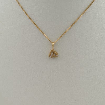 Small Grand Teton slide in 14kt yellow gold with Diamonds. The diamonds are brilliant-cut and channel set. The chain is not included.