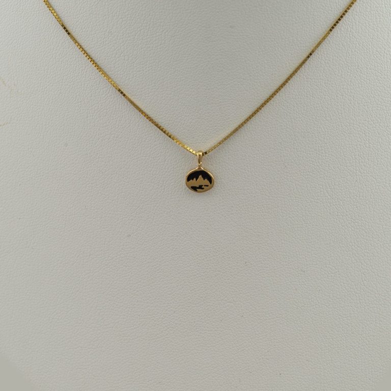 Tiny teton pendant in 14kt yellow gold. The chain is not included in the price. We also offer this pendant in 14kt white gold and sterling silver.