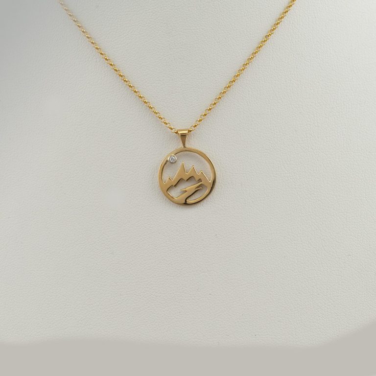 Open teton pendant with white diamond in 14kt yellow gold. Also, available in 14kt white gold and sterling silver. Can be ordered without a diamond.