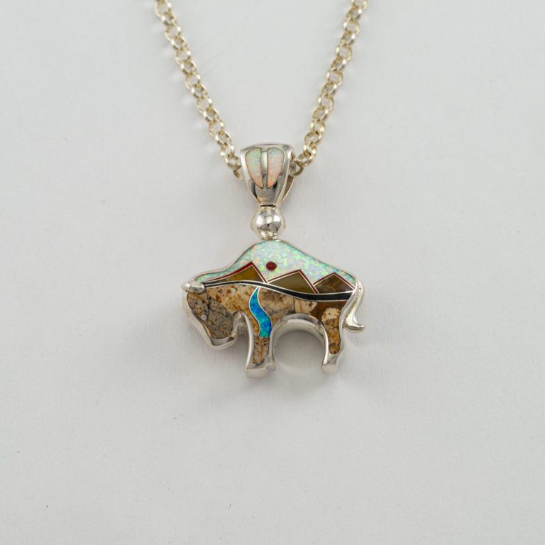 This is our Reversible Bison pendant in Sterling Silver. This pendant is available in two sizes. This is the larger of the two sizes. Chain included.