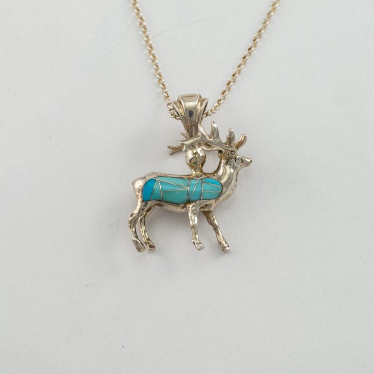 Reversible elk pendant in sterling silver