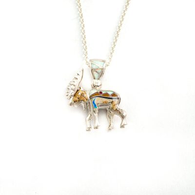 This is the inlaid moose pendant. It has been cast in Sterling Silver and is Reversible. The inlay is done by hand.