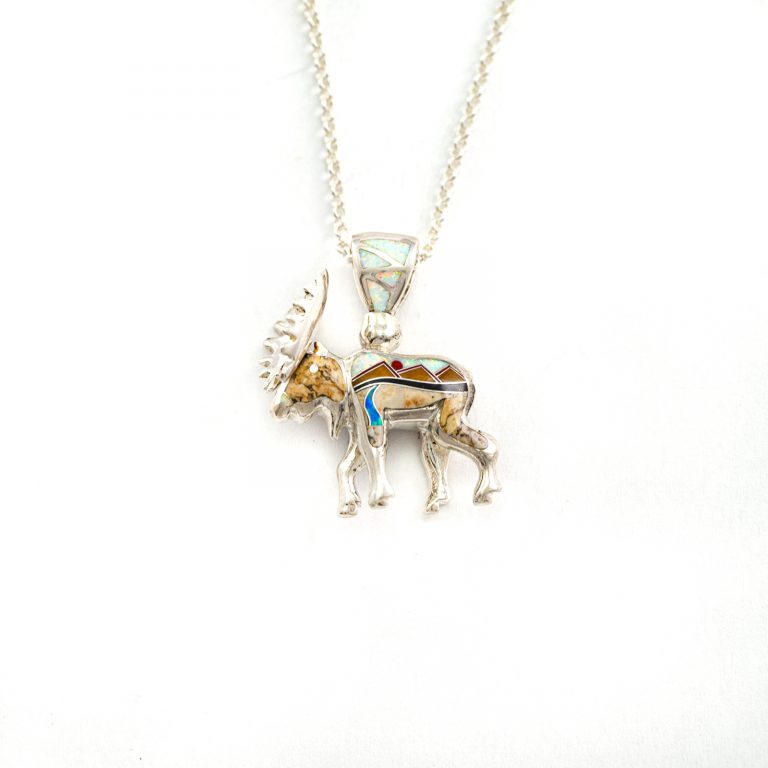 This is the inlaid moose pendant. It has been cast in Sterling Silver and is Reversible. The inlay is done by hand.