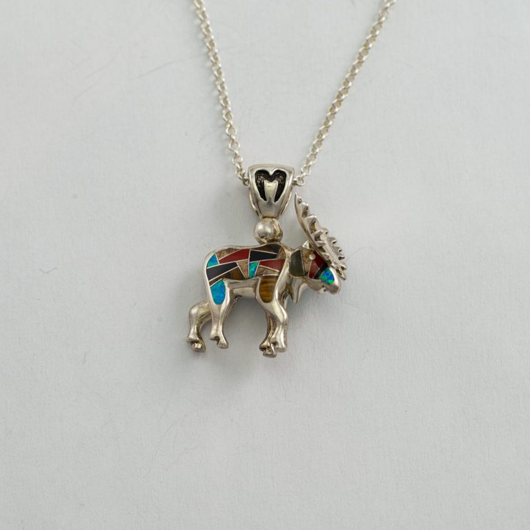 This is the Small Moose pendant in sterling silver with hand-done inlay. It is reversible and both sides are inlaid. The chain is included in the price.