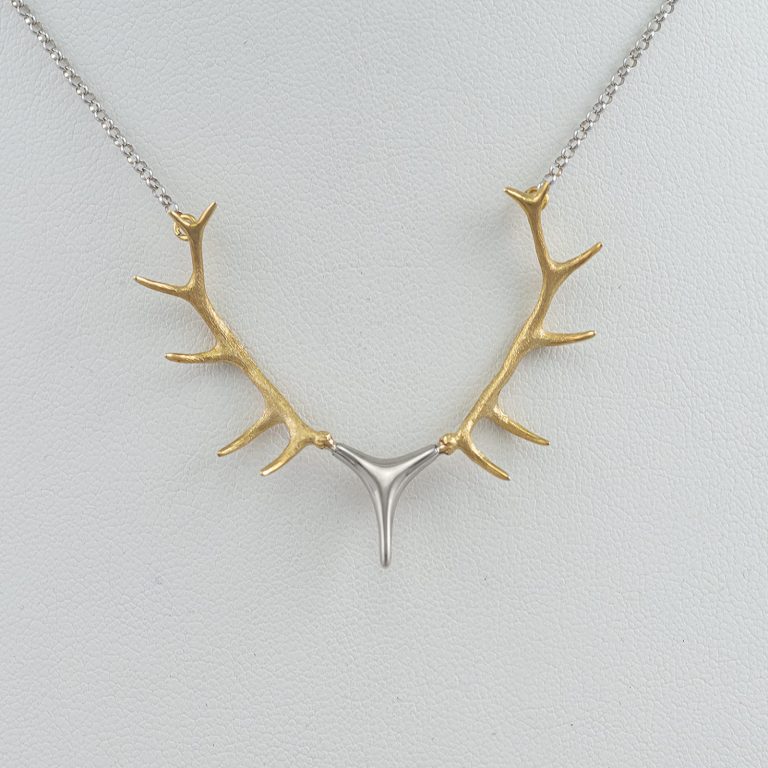 This is our Large antler necklace in 14kt two tone gold. The chain is included in the price. We have several other versions as well.