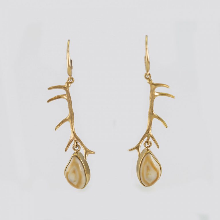 These are antler earrings with Ivory. The ivory is elk ivory that was harvested locally. The gold is 14kt yellow as are the leverbacks.
