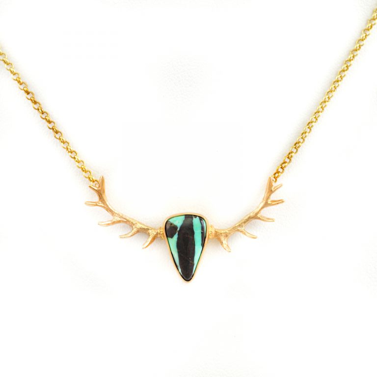 This Turquoise Antler Necklace in 14kt yellow gold. The chain is included in the price. The Turquoise is from Carico Lake.