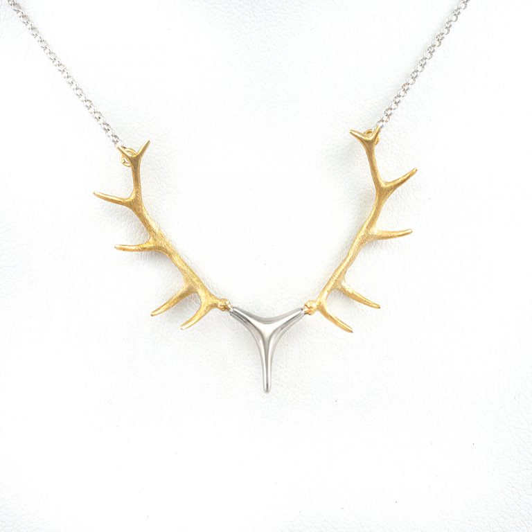 This is our Large antler necklace in 14kt two tone gold. The chain is included in the price. We have several other versions as well.