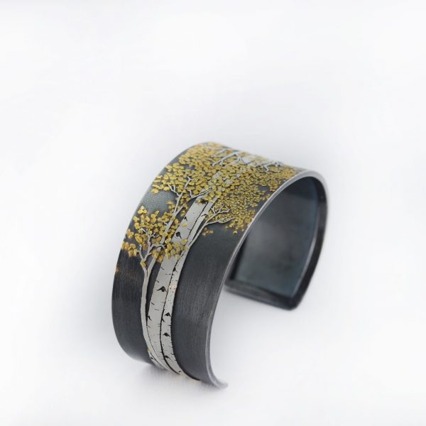 Wide Aspen Cuff with Silver and Gold. Shown in a size large