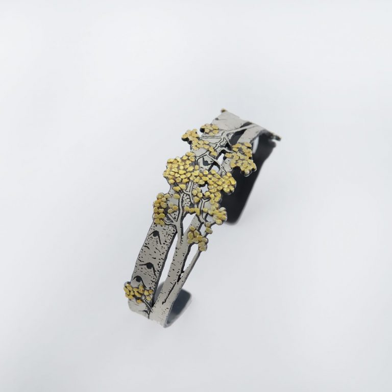 Aspen cuff with Argentium Silver and Placer Gold. This piece was designed and created by Wolfgang Vaatz. Shown in a size Large.
