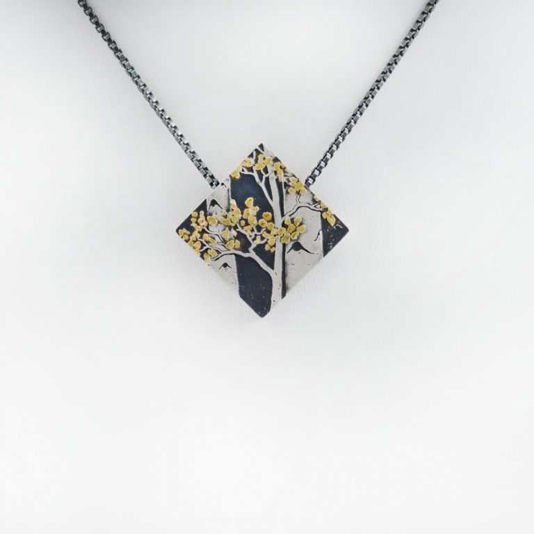 Geometric Aspen pendant by Wolfgang Vaatz in Silver and gold. The silver is argentium and the gold is from Placerville California.