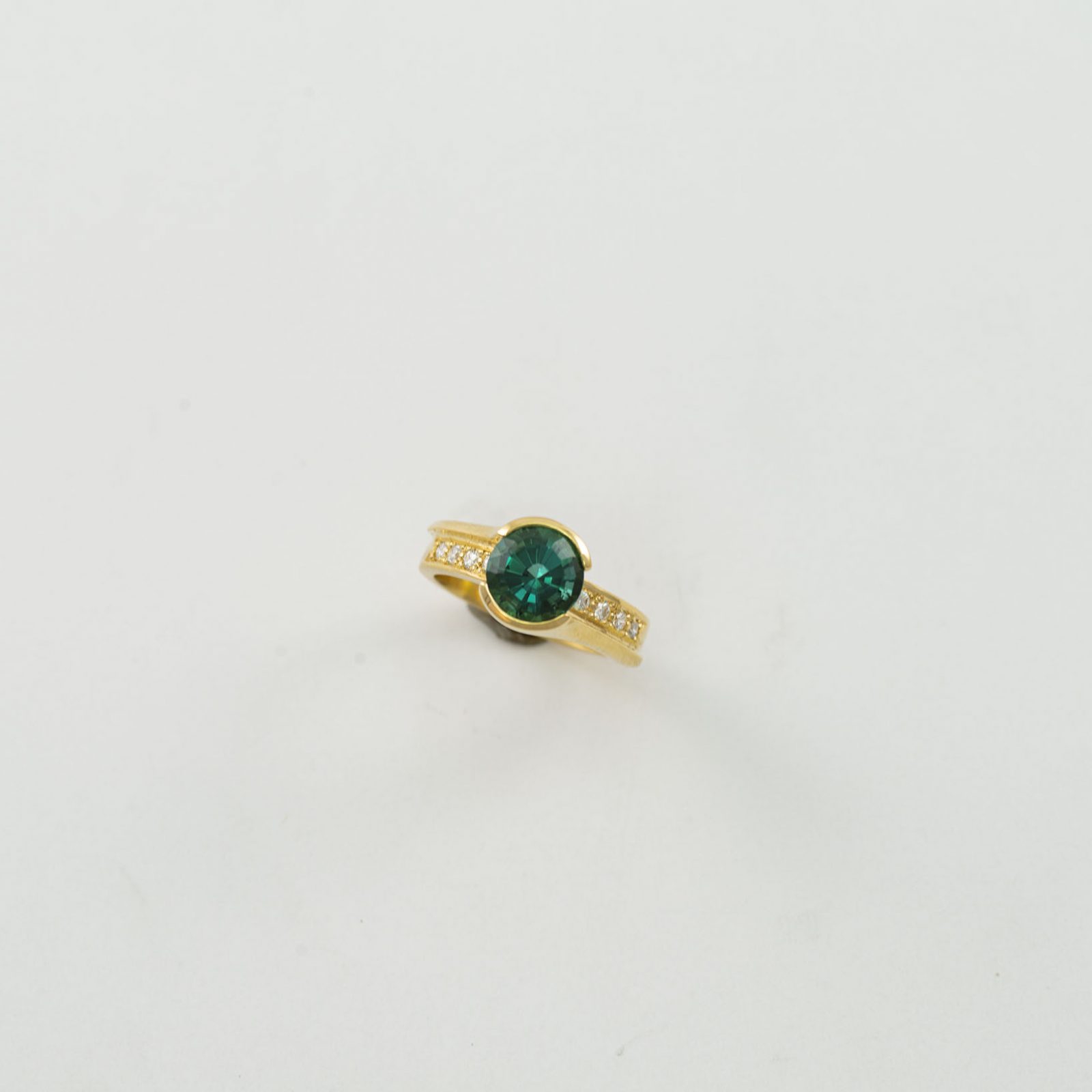 Green Tourmaline Ring in 14kt yellow gold with diamond accents.
