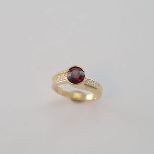 Rhodalite ring with diamonds and gold