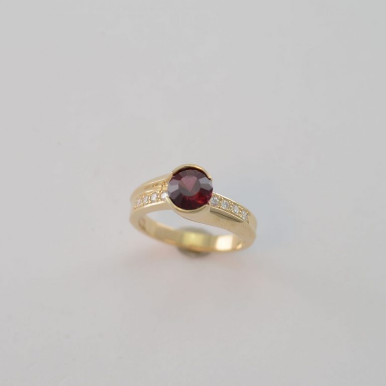 Rhodalite ring with diamonds and gold