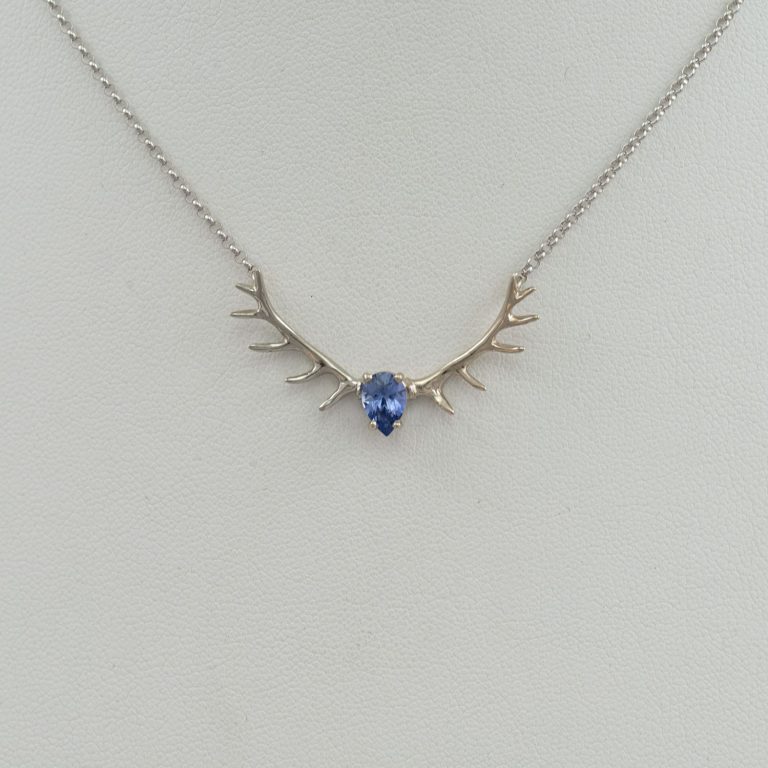 Sapphire and antler pendant in 14kt white gold