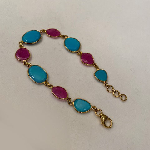 Ruby and turquoise bracelet in 18kt yellow gold