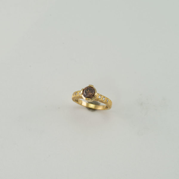 Cognac Diamond ring with white diamond accents in yellow gold