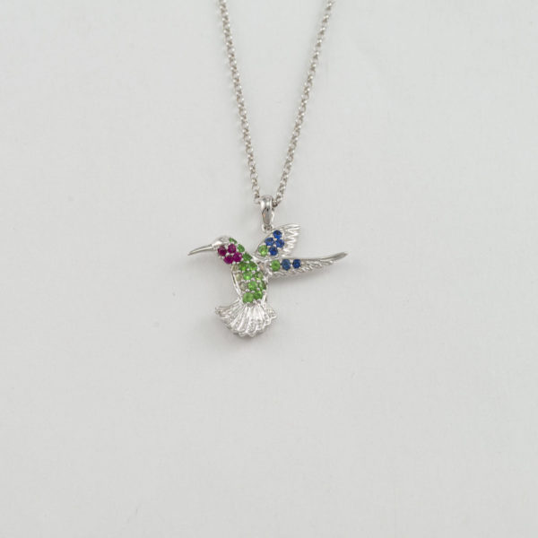 reversible hummingbird pendant with white gold, rubies, sapphires and tsavorite garnets
