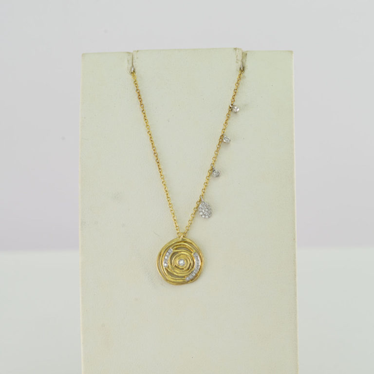 Two tone pendant with 14kt gold and white diamonds