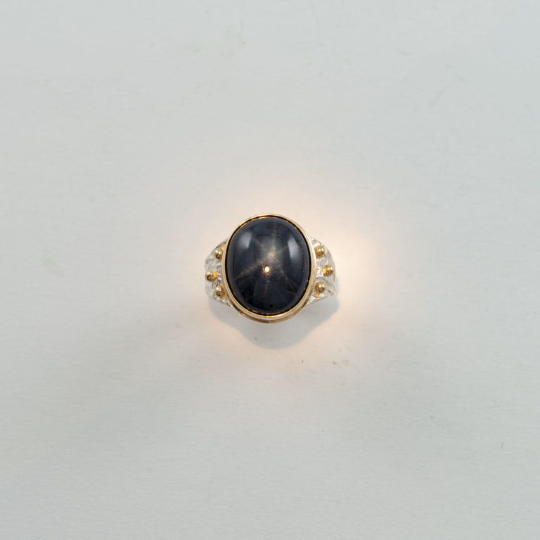 Men's star sapphire ring with silver and gold