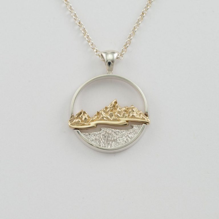 This is our silver and gold teton pendant. The chain is included