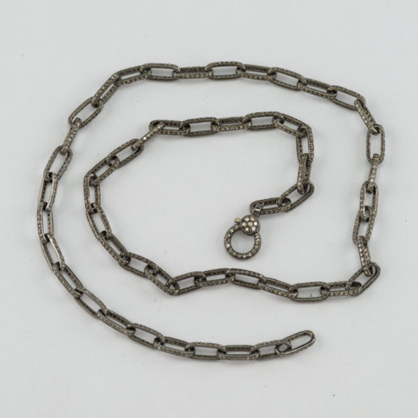 This is a silver and diamond necklace. The diamonds have be paved in the oxidized sterling silver. The length is 18".