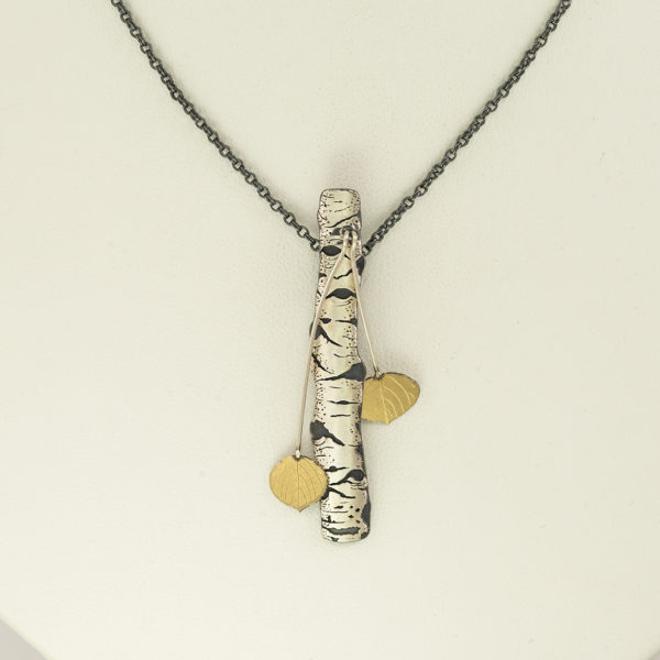 Quaking aspen pendant by Wolfgang Vaatz. This piece was created using Argentium silver, Sterling silver and 18kt yellow gold.