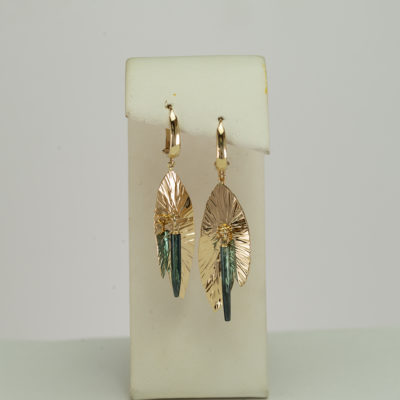These green Tourmaline earrings were made in 14kt yellow gold. The tourmalines have been cut into "cylinders".