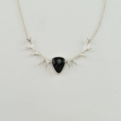 This is our Wyoming Jade Antler Necklace. The black jade has been set in sterling silver. The chain is 16" long and has a lobster claw. 