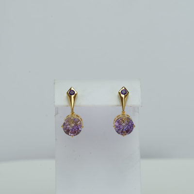 These Ametrine earrings have been set in Sterling Silver with a 14kt yellow gold plate. Accenting the ametrines are two amethysts. We also have a pendant to match.