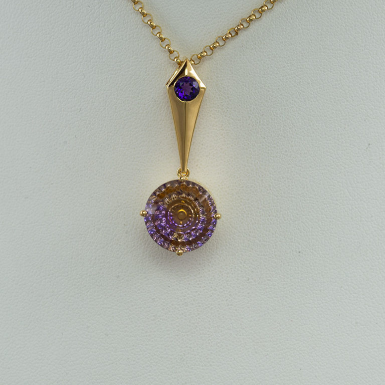 Here is a fantasy cut Ametrine Pendant. It has been cast in Silver and plated in 14kt yellow gold. This pendant is one-of-a-kind and the chain is not included in the price.