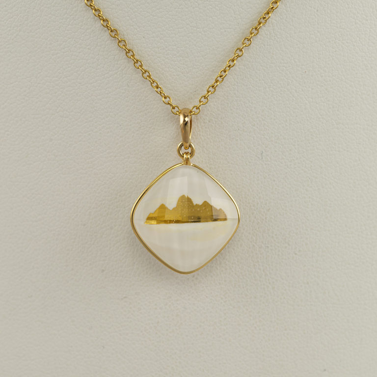 24kt teton pendant with white quartz and 18kt yellow gold.