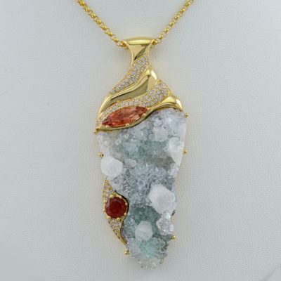 This Sunstone and Druzy pendant has been cast in 18kt yellow gold. Accenting the Druzy and Sunstones are White Sapphires. The chain is not included in the price. 