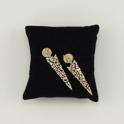These Diamond Earrings have been cast in 14kt yellow Gold. The diamonds are a mixture of round and baguette cut.