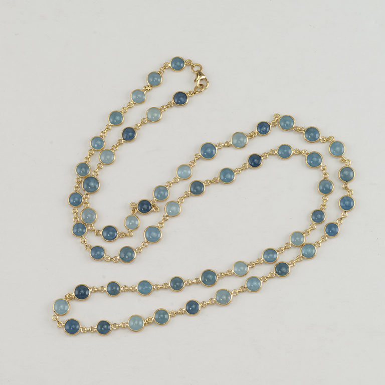 Here is an Aquamarine necklace. The aquamarine has been bezel set in 14kt yellow gold. The necklace measures 28" in length.